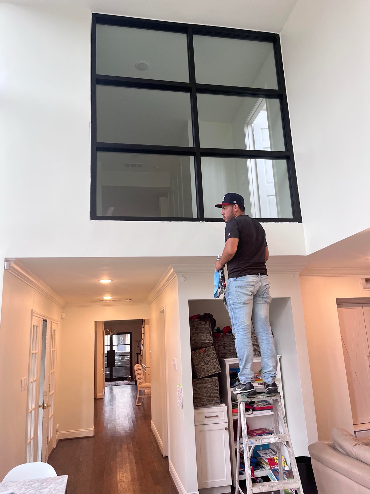 Interior glass partition wall with black steel frame — residential loft