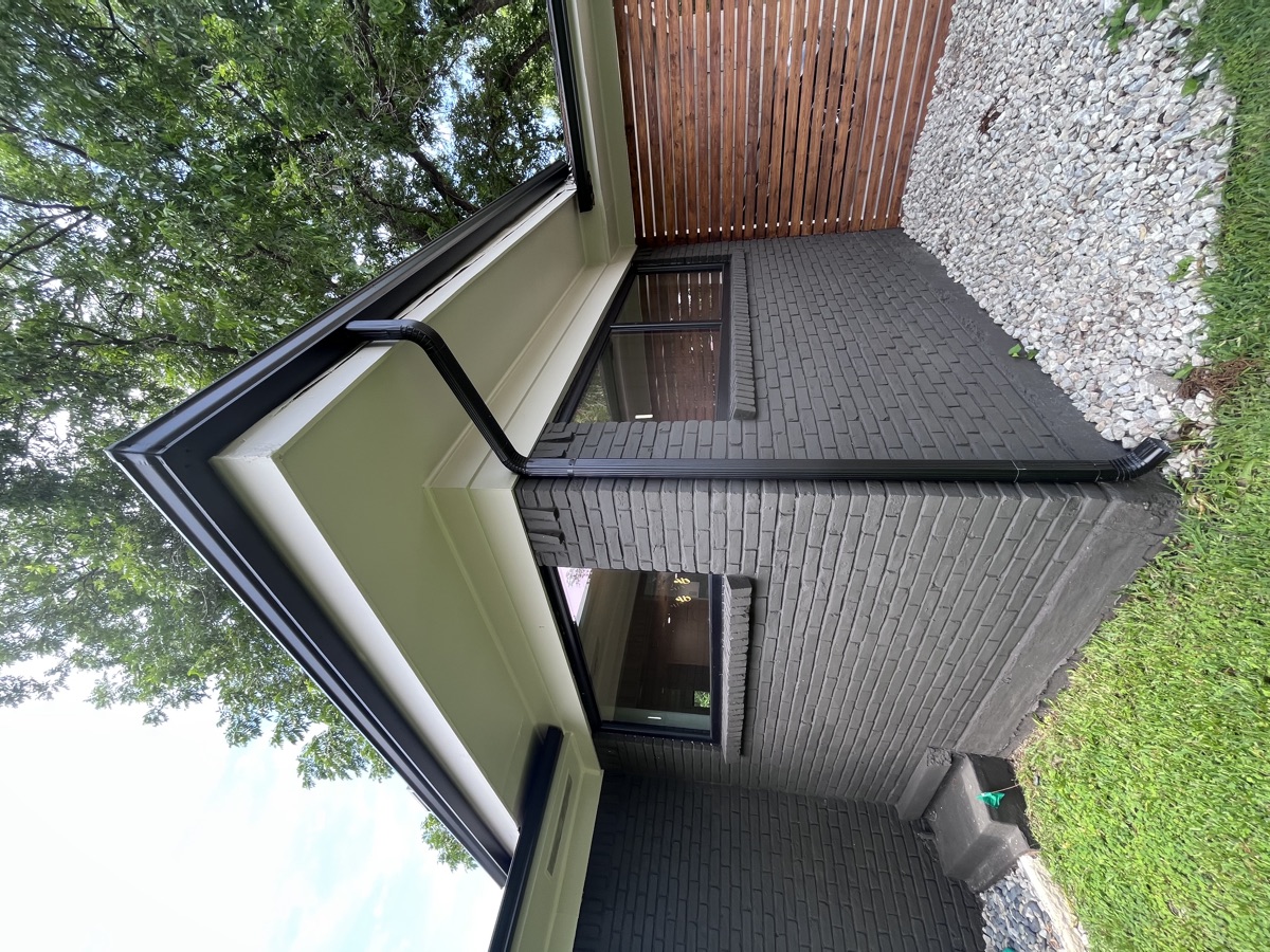Residential exterior with new window installation